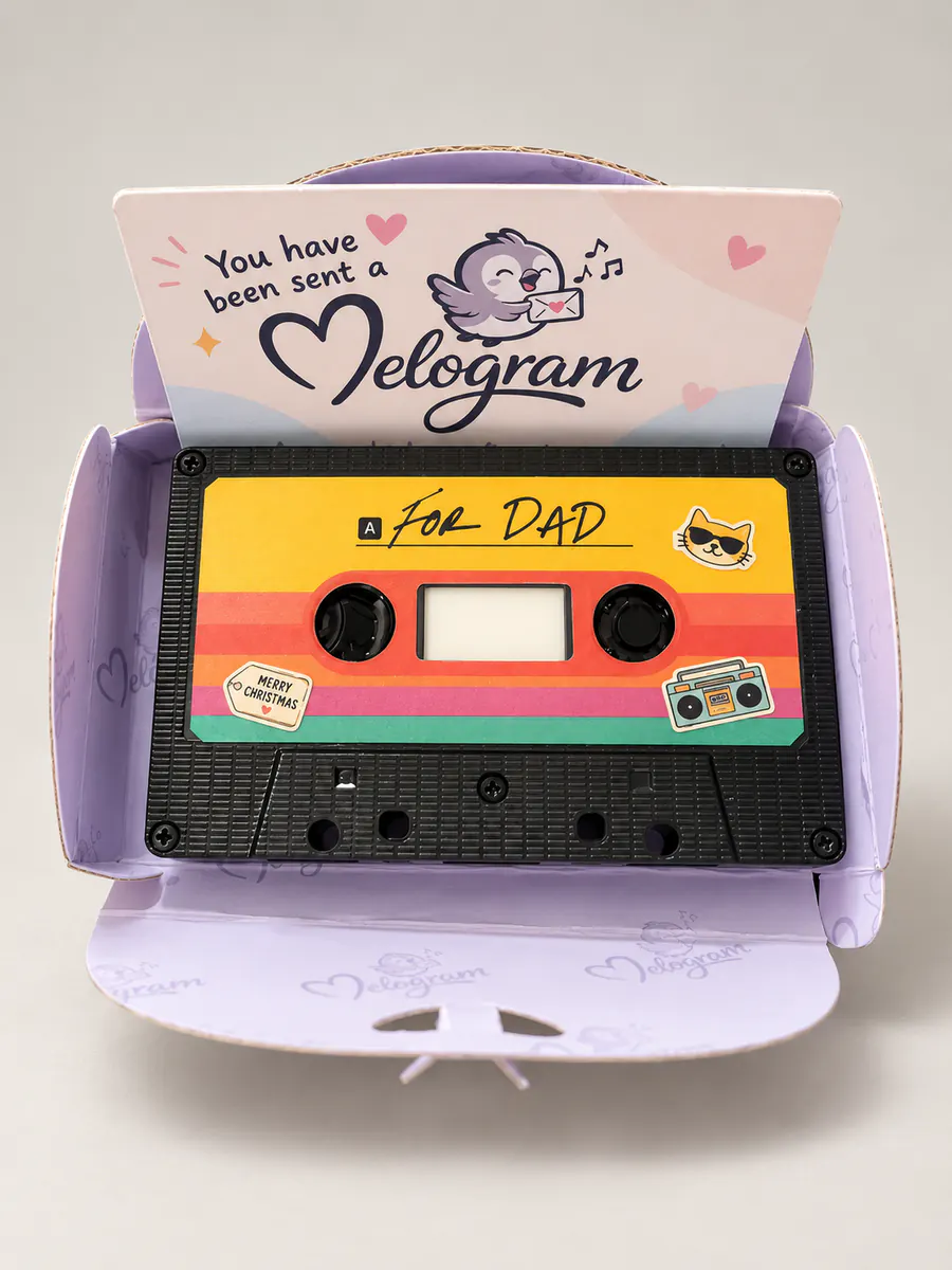 An open Melogram presentation box containing a colourful cassette song gift labelled For Dad